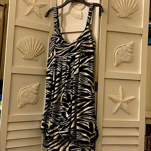 Dres,  Medium size, 92% polyester & 8% spandex.